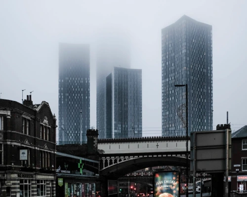 manchester city tower buildings surrounded by fog